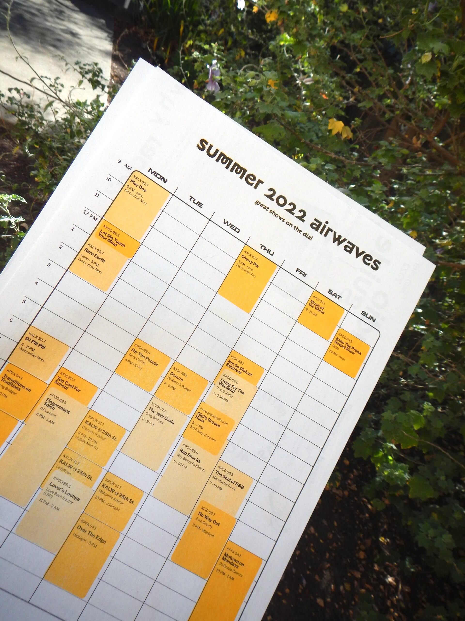Printed schedule of radio shows in black and sunflower