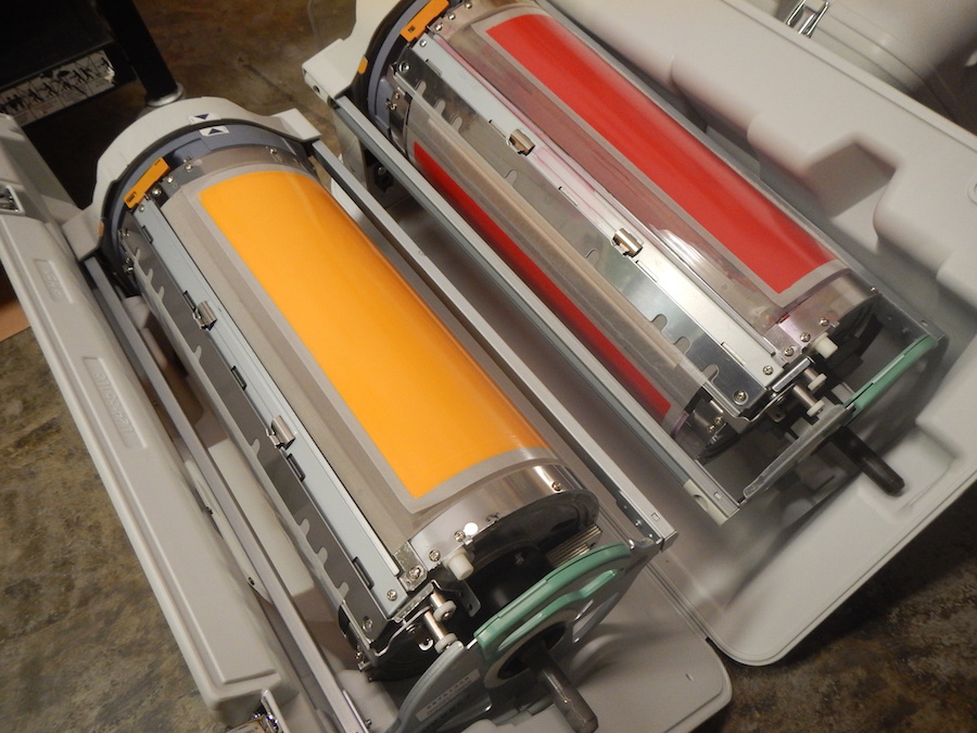 Red and yellow Riso ink drums