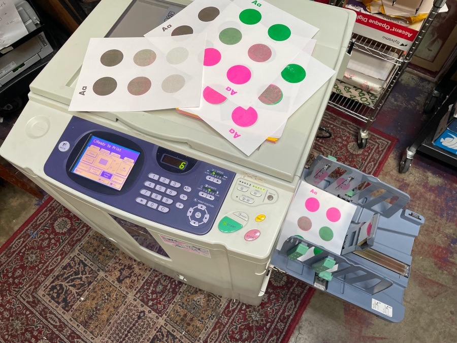 Multi-color example of Riso prints on a machine